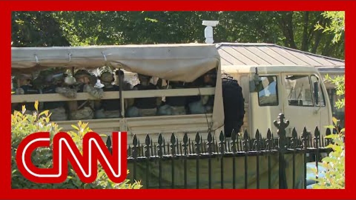 Military vehicles move outside White House amid protests