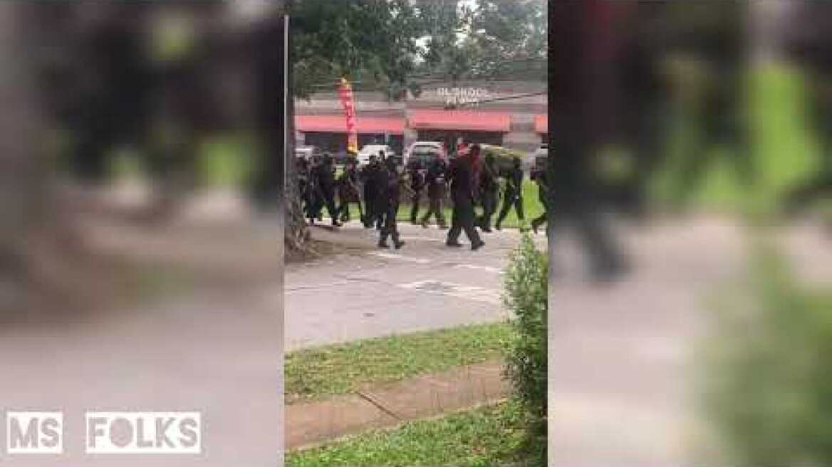 Heavily armed Black Panthers target Confederate monument used by KKK as American flag is burned