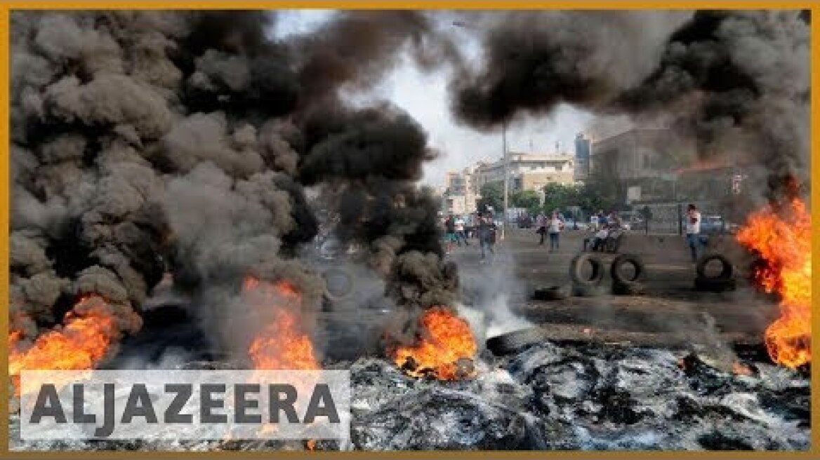 Amid protests, Lebanon's Hariri sets deadline to resolve crisis