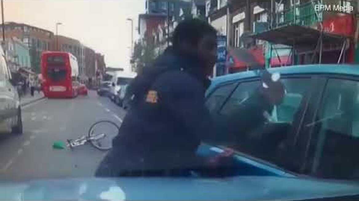 Shocking moment cyclist pulls knife on driver in fit of road rage