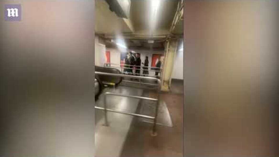 Two men brawl in Grand Central Station and tumble down escalator