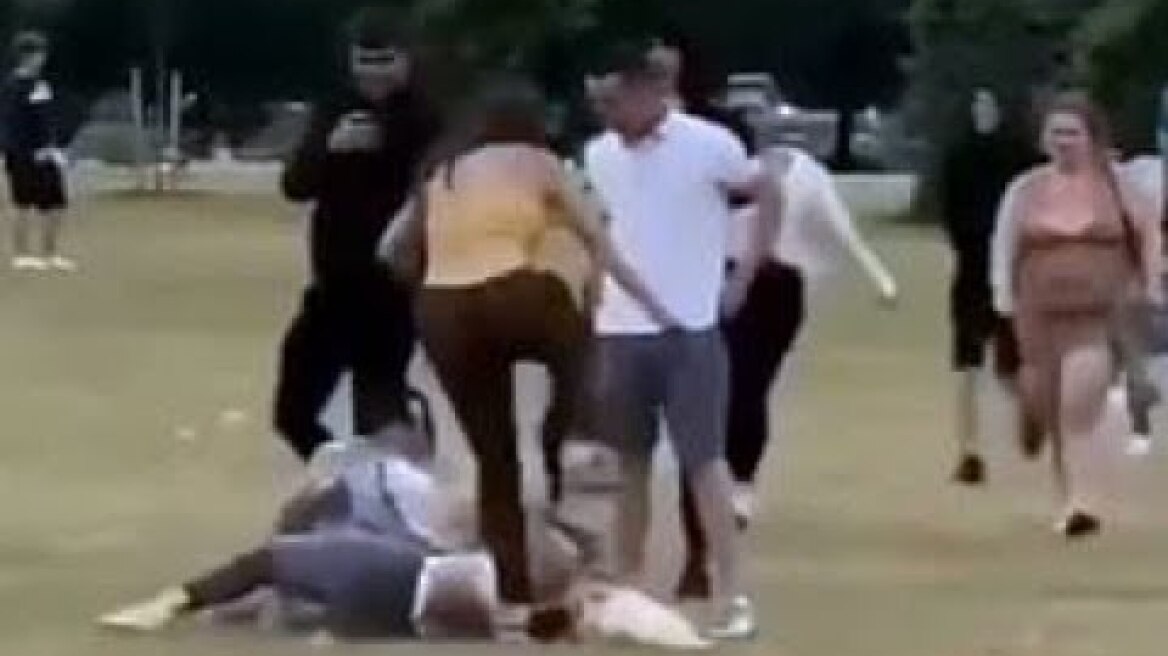 Two women repeatedly kick another woman in the head