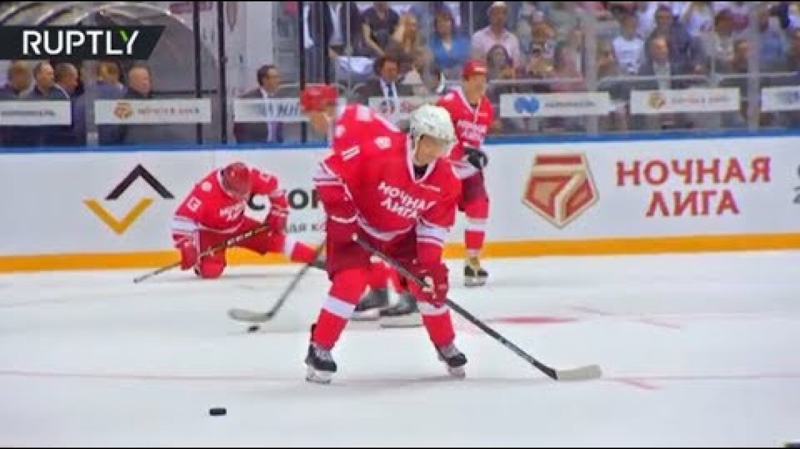 Putin hits the ice & shows off his hockey skills in Sochi