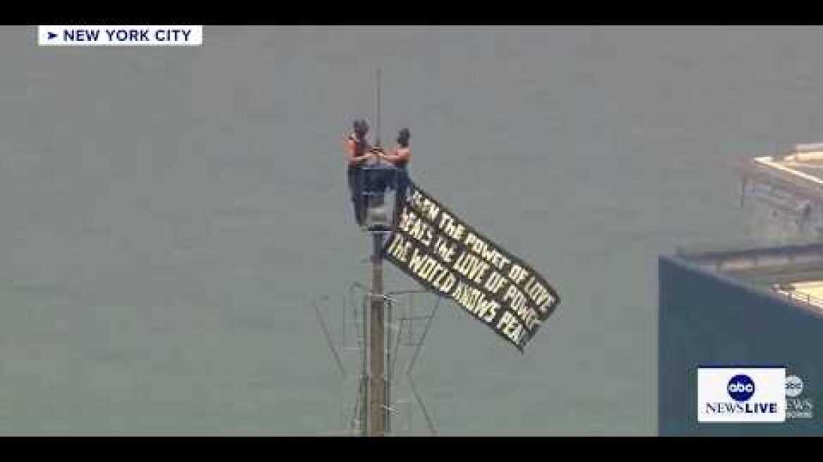 Two people climb Empire State Building