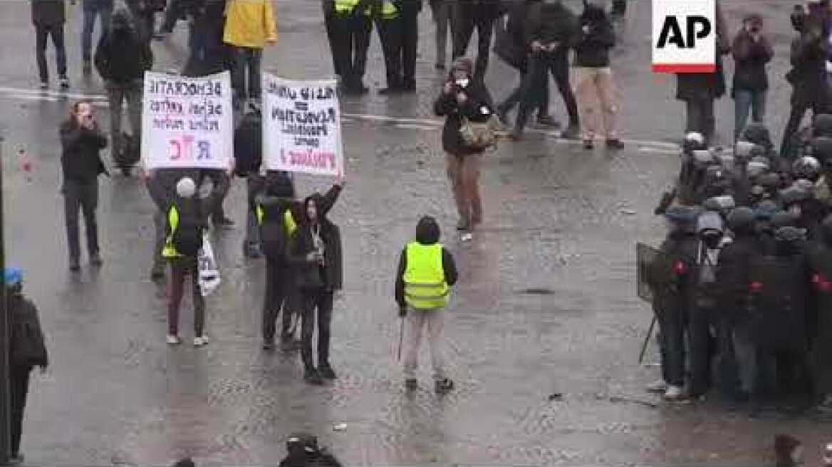 Paris police fire tear gas at yellow vests protest