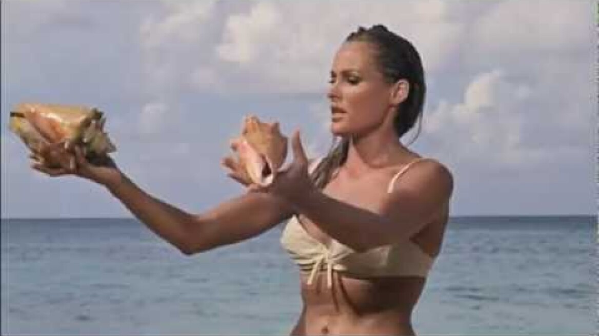 Ursula Andress (Honey Ryder) in bikini walking Jamaica's Dunn's River beach in Dr No 1962