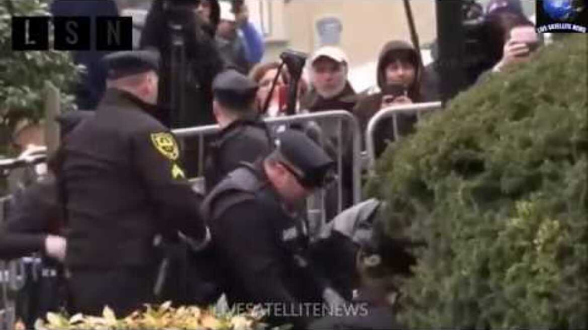Topless Protester Jumps Out as Bill Cosby Enters Court  April 9 2018