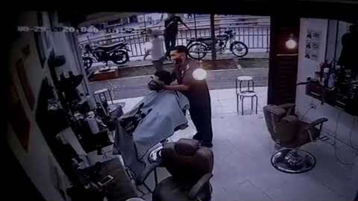 Horrifying moment hit man kills customer in barber's chair