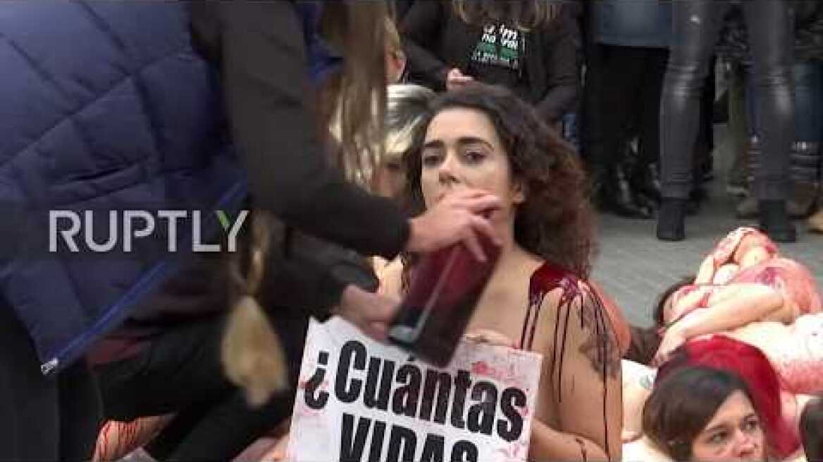 Spain: Naked and bloodied activists stage anti-fur protest in Barcelona *EXPLICIT*