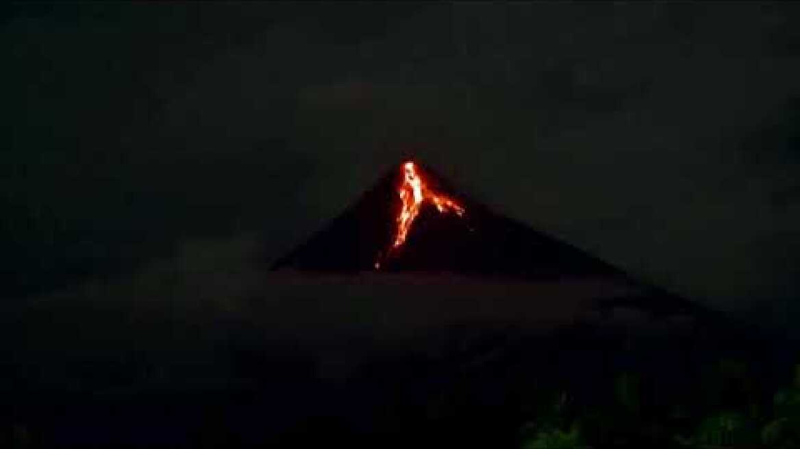 Philippines' Mayon volcano lights up the night
