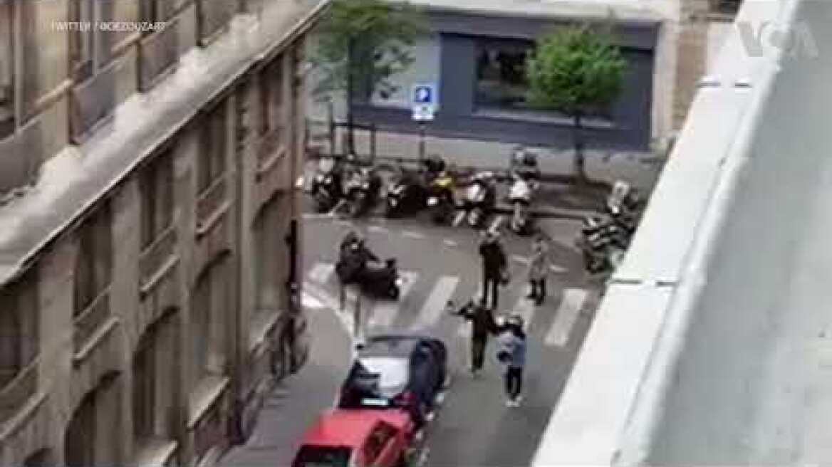 People running, body lying on floor after Paris stabbing