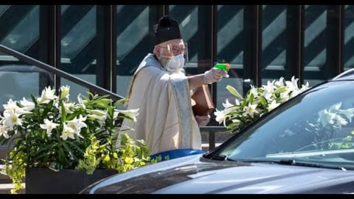 Michigan priest goes viral after using holy water squirt gun during drive-thru service