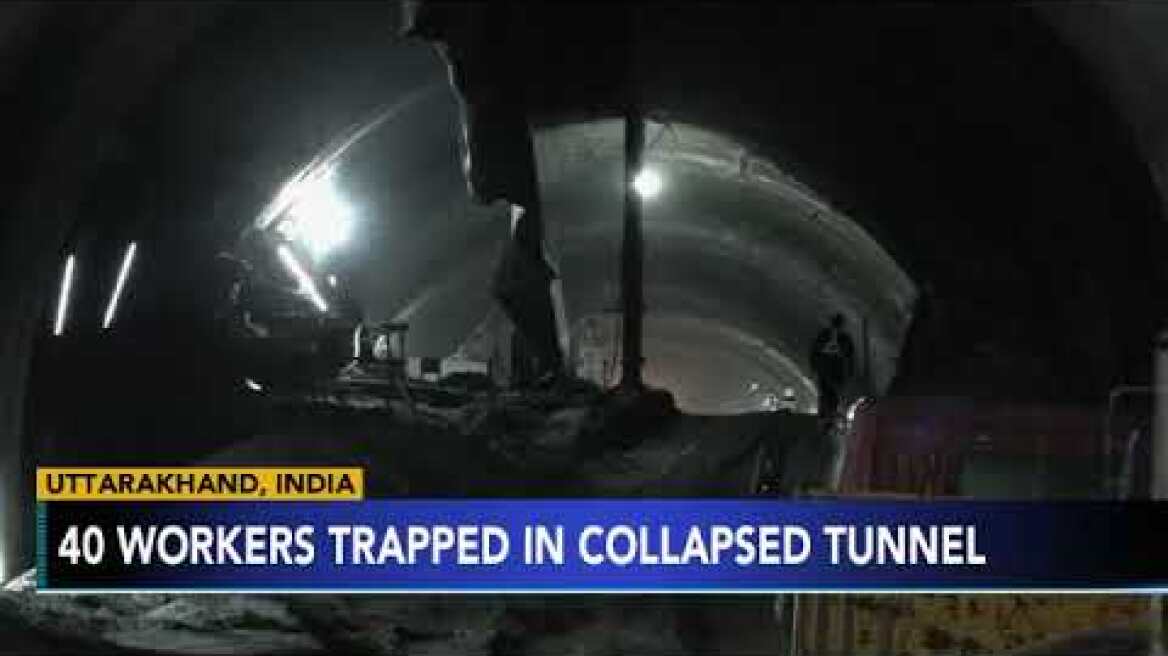 Rescuers dig to reach 40 workers trapped in collapsed road tunnel in north India