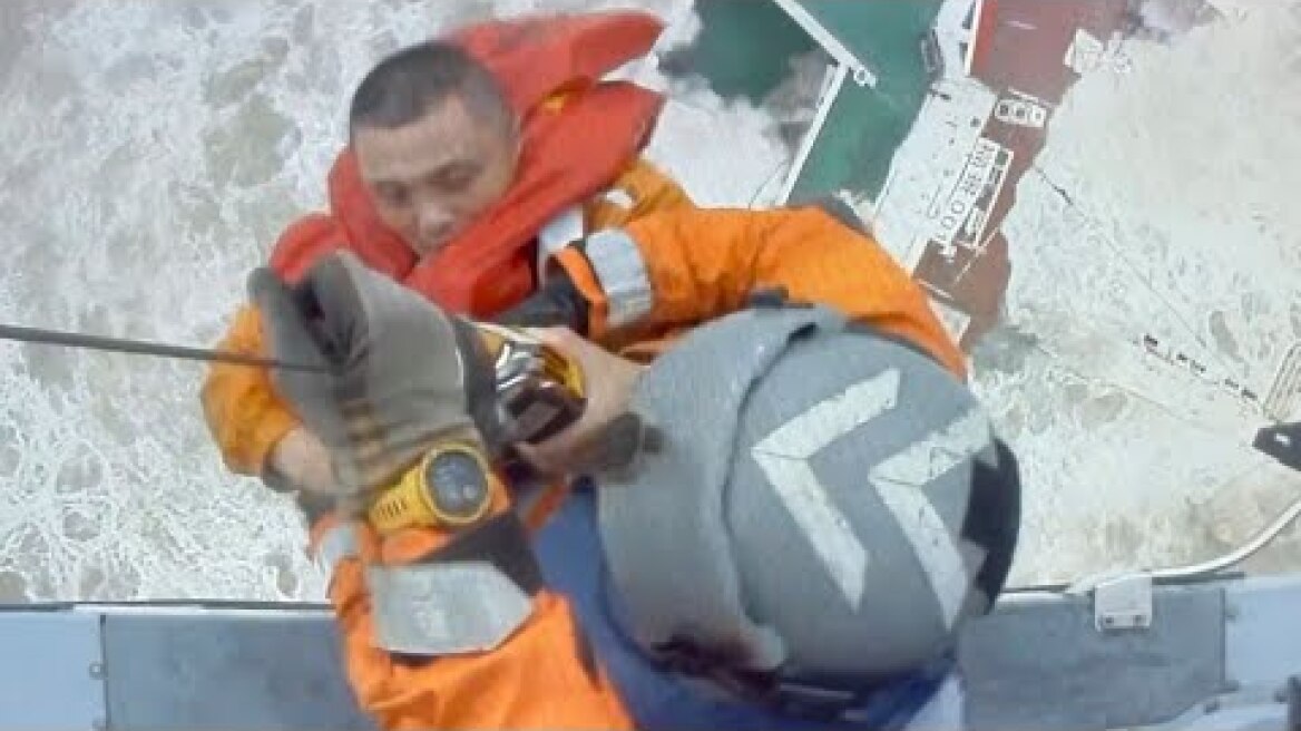 Dramatic moment sailor is airlifted from ship moments before it sinks in South China Sea