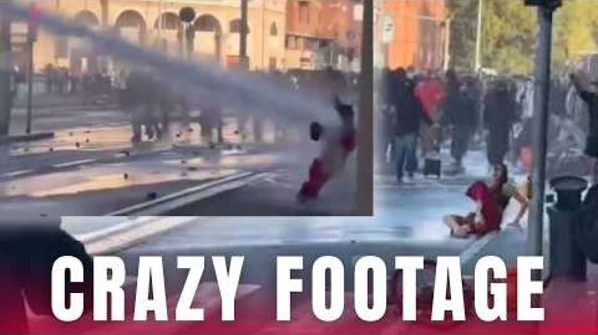 WATCH: Protester BLASTED off her feet by water cannon during Italy riots