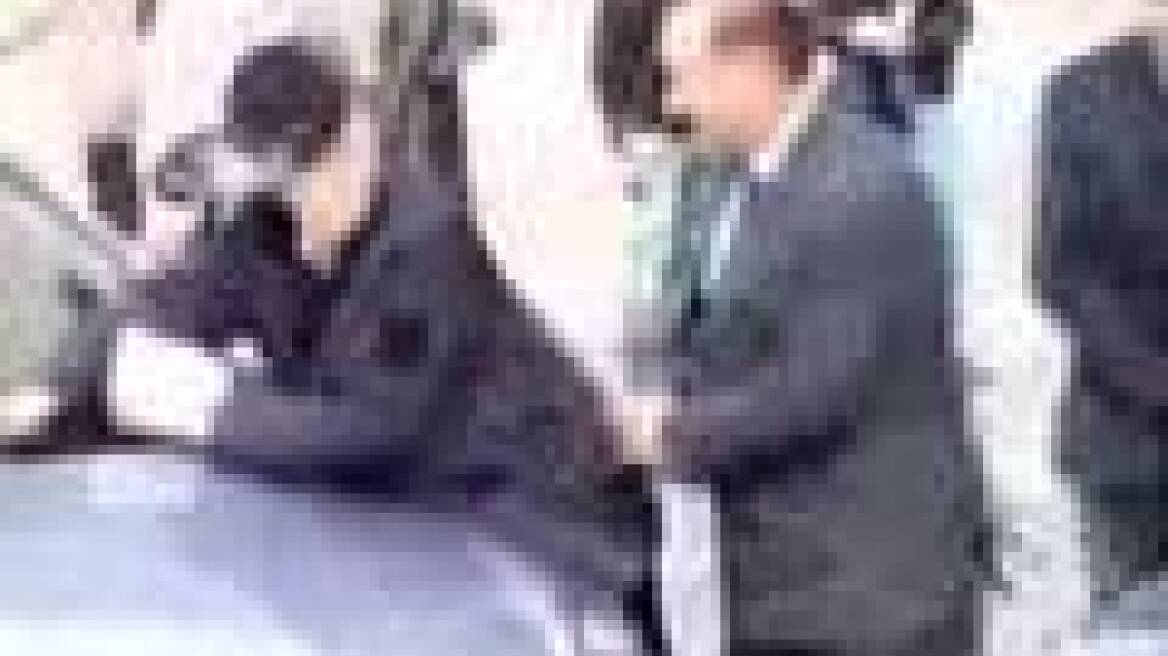 Silvio Berlusconi takes traffic cop from behind