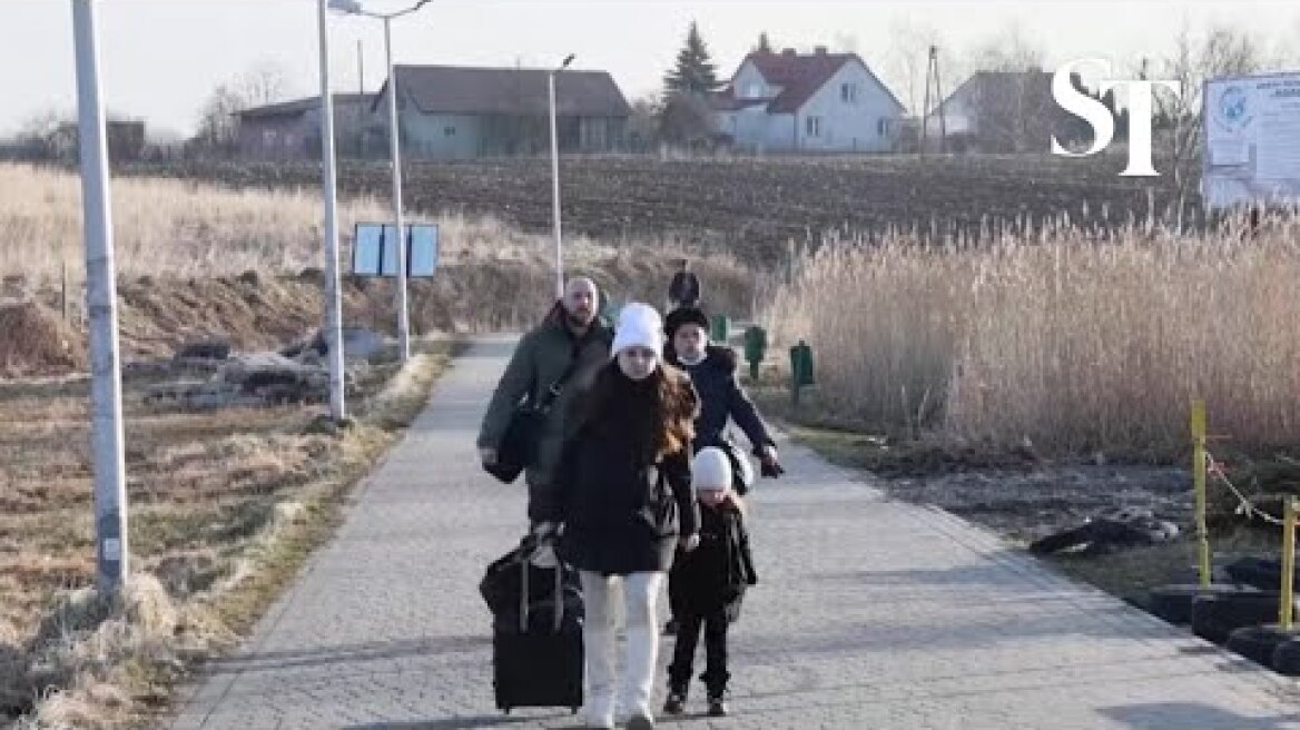Ukrainians flee to Poland after Russian military attack