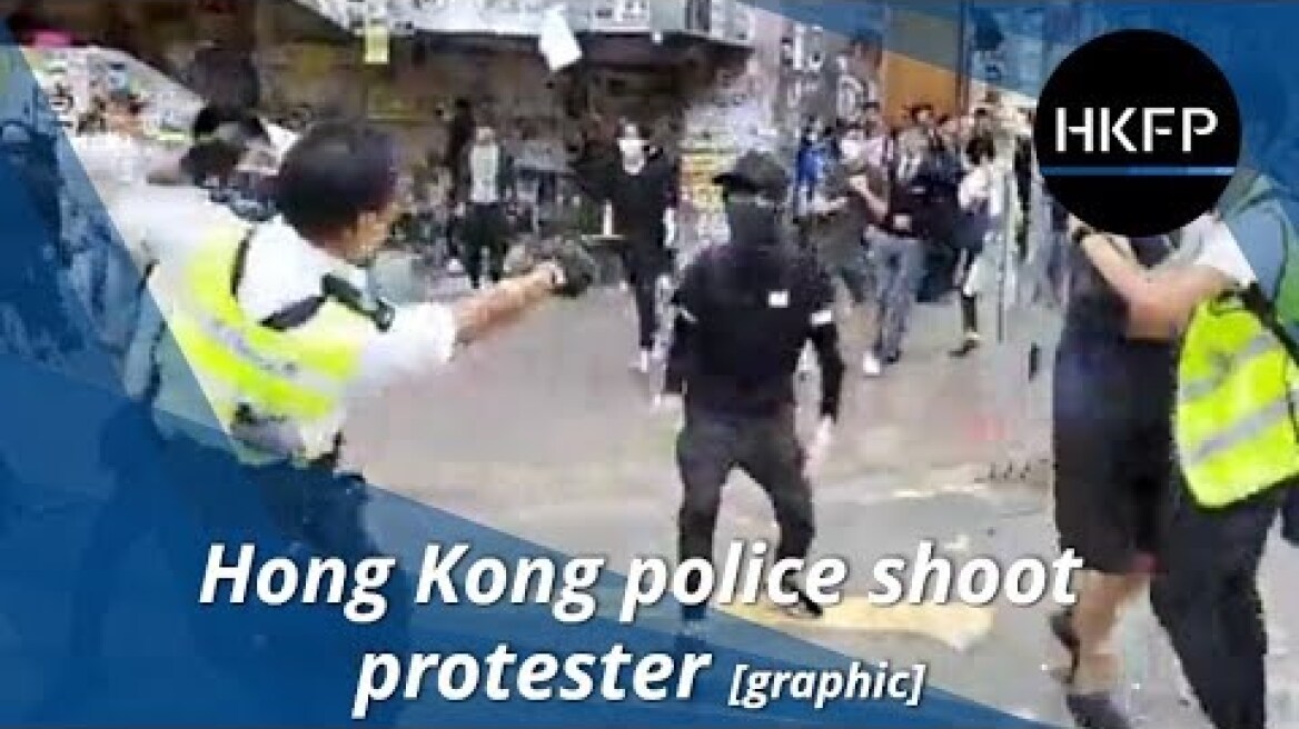 Hong Kong police shoot black-clad protester in stomach
