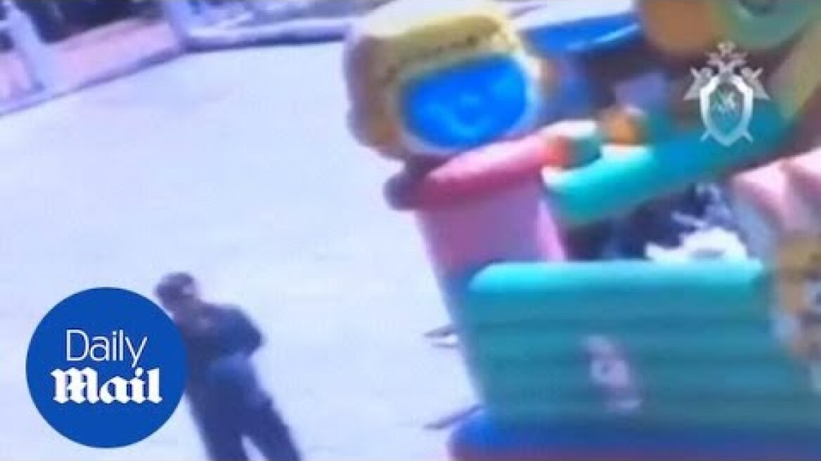CCTV footage shows the moment bouncy castle flies off in Siberia