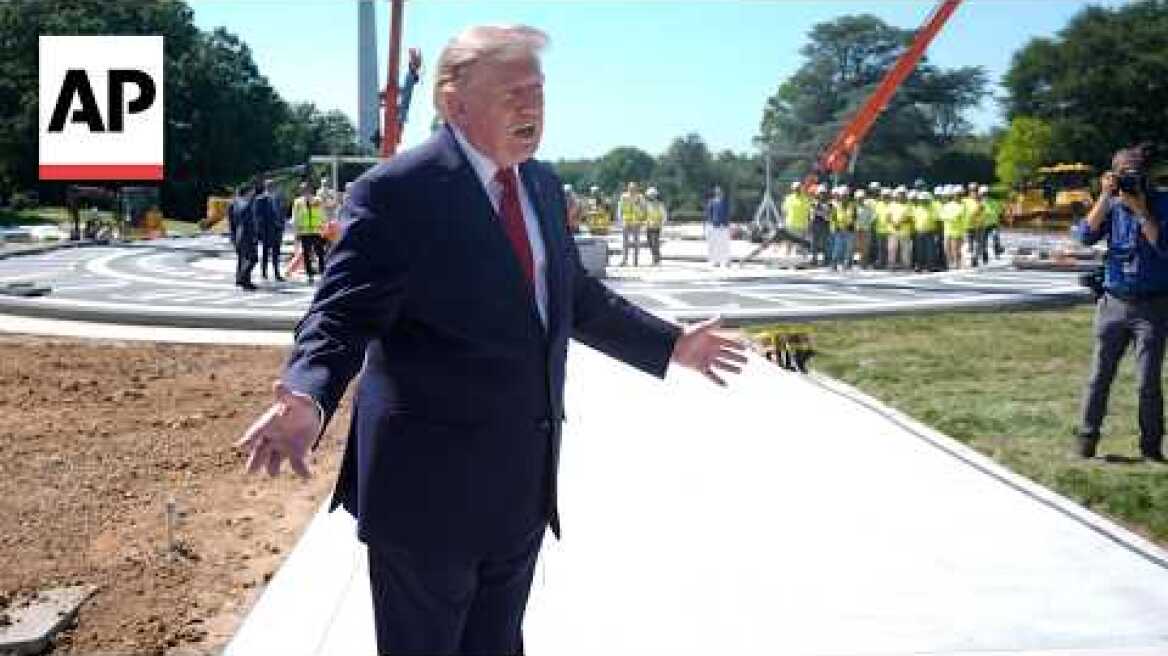 Trump shows reporters a new granite helipad at the White House