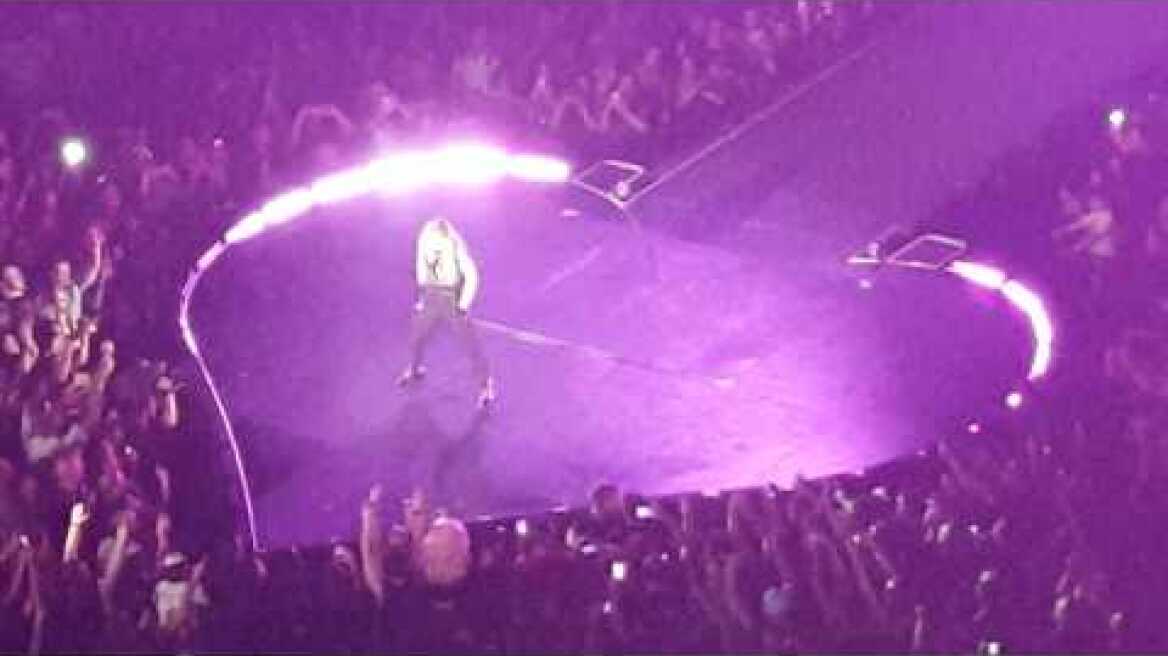 fan throws a coat on stage at Madonna Concert Montreal