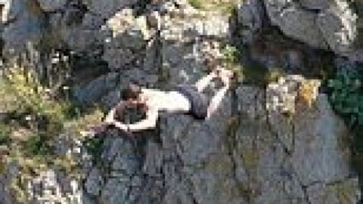 Reckless cliff jumper bellyflops 200 feet into ocean at Durdle Door