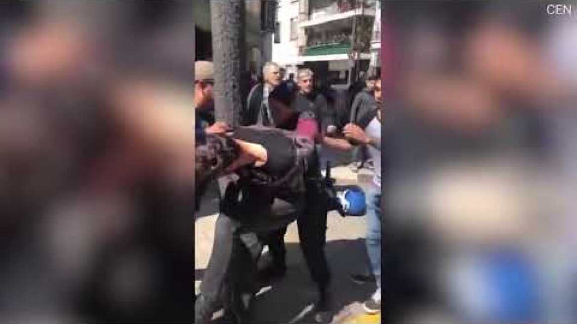 Video: Angry mob pummels alleged thief as female police officer arrests him
