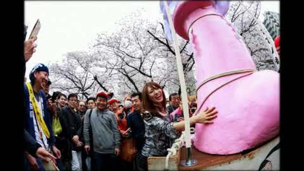 Penis festival attracts thousands as giant phallus paraded through streets