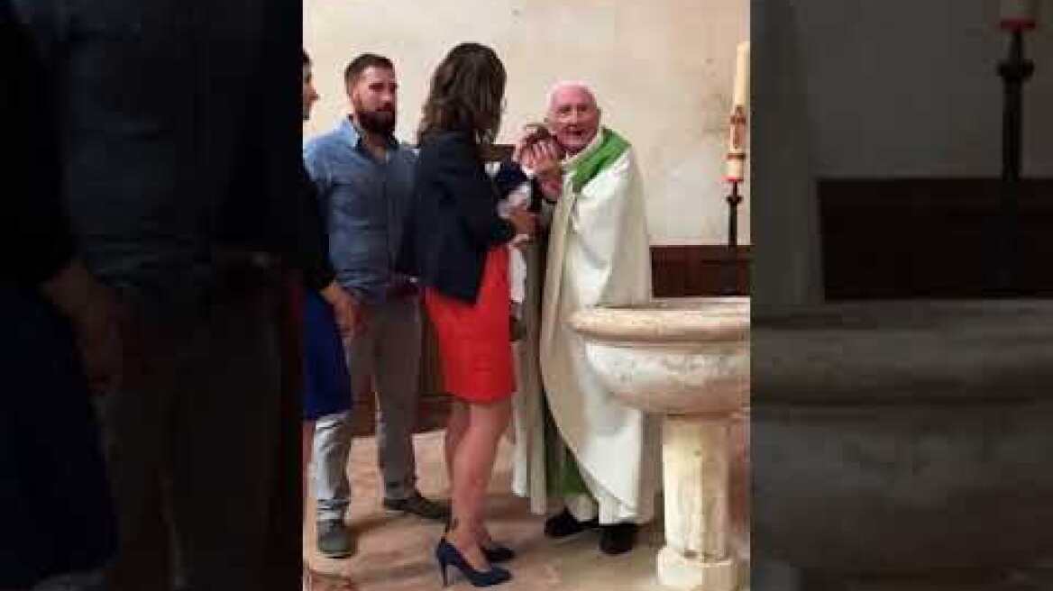 Priest Slaps Baby Being Baptized