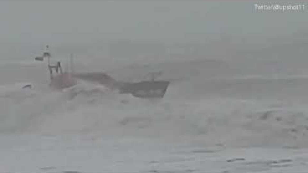 Coastguard boat almost capsizes while rescuing surfer in storm
