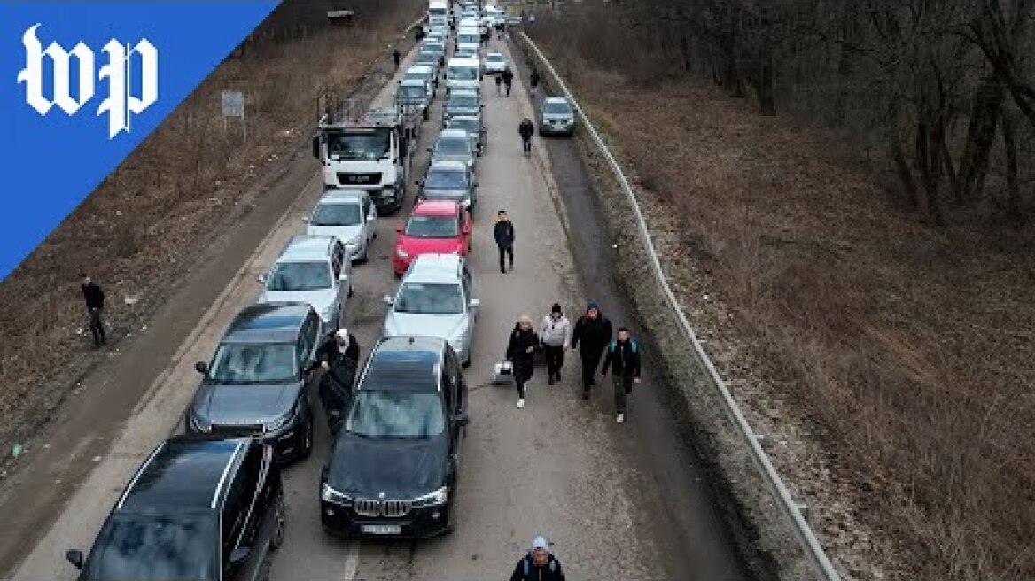 Drone video shows Ukrainians fleeing to Poland
