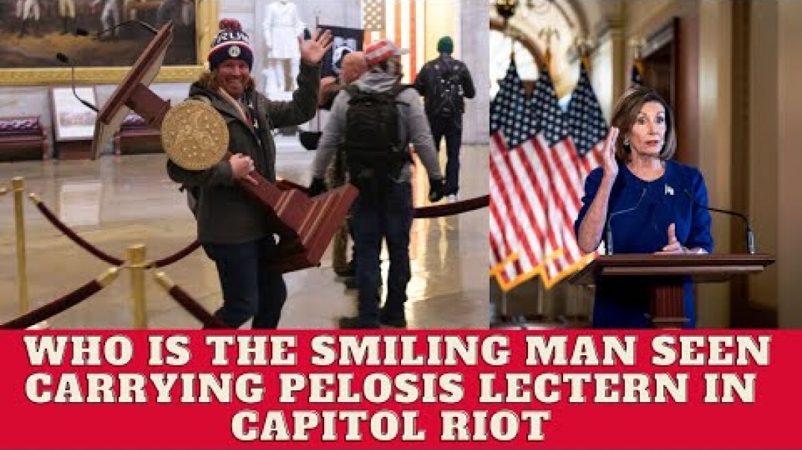 the smiling man seen carrying pelosis lectern in capitol riot