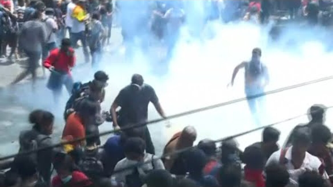 Thousands mob Sri Lanka PM's office after president flees country | AFP