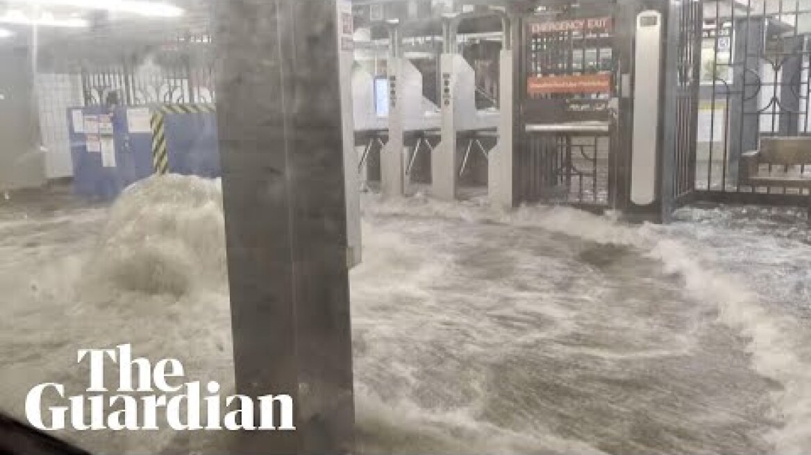 Footage shows flood water gushing into New York subway station during heavy rain
