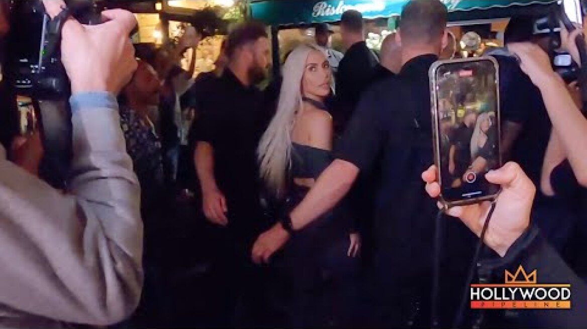 Kim Kardashian surrounded by fans in Italy