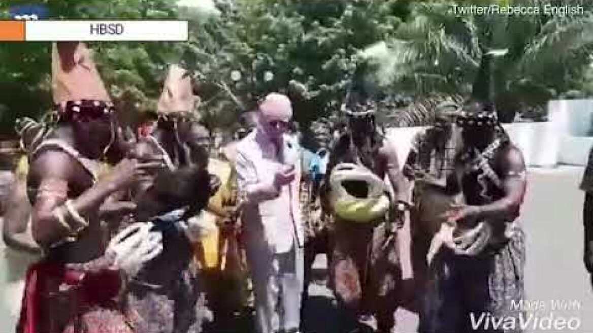 Prince Charles dances along with Ghanians whilst on tour with Camilla