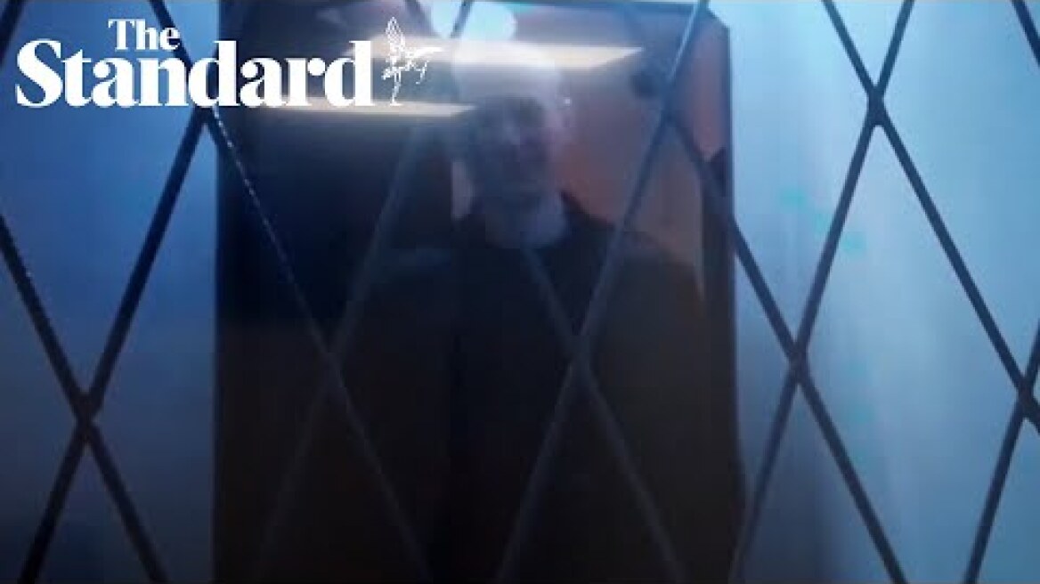 Putin opponent Alexei Navalny jokes in court via video from Russian Arctic prison