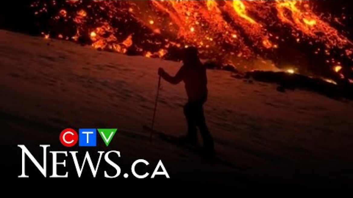 Daredevils ski down Italy's Mount Etna near lava flow