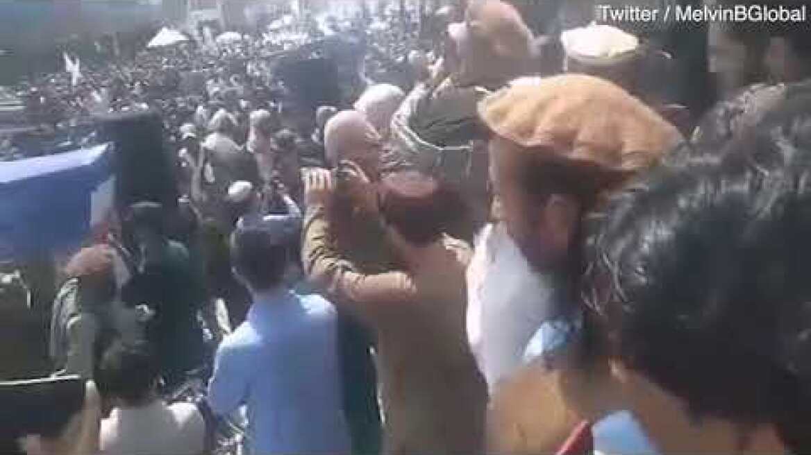 PEOPLE CARRY COFFIN WITH UK FLAG TO CELEBRATE TALIBAN VICTORY