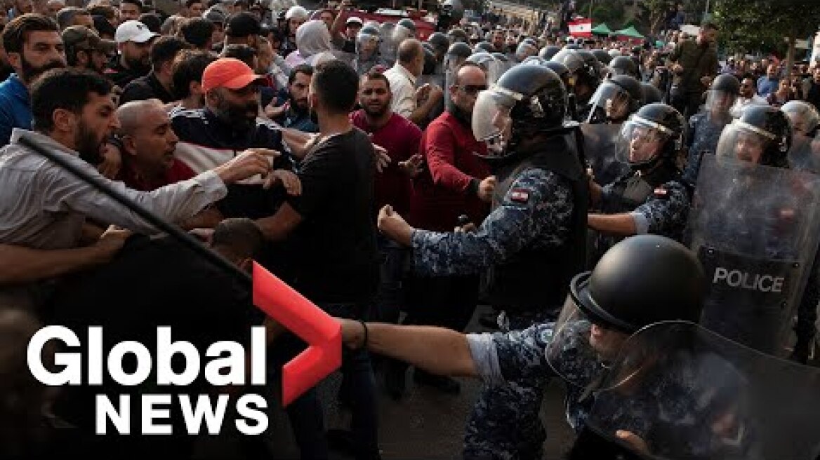 Lebanon protests: Riot police intervene as Hezbollah supporters scuffle with protesters