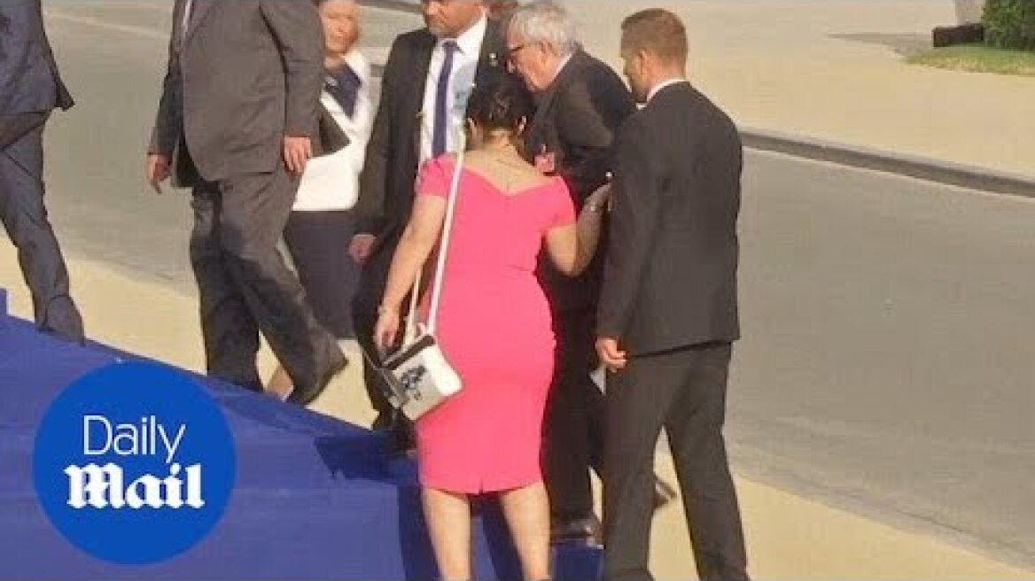 Jean-Claude Juncker stumbles and is helped by leaders at NATO gala - Daily Mail