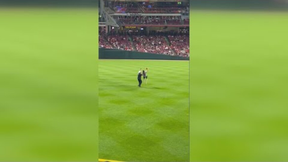 VIDEO | Reds fan does backflip on field before getting tased by police officer in Cincinnati