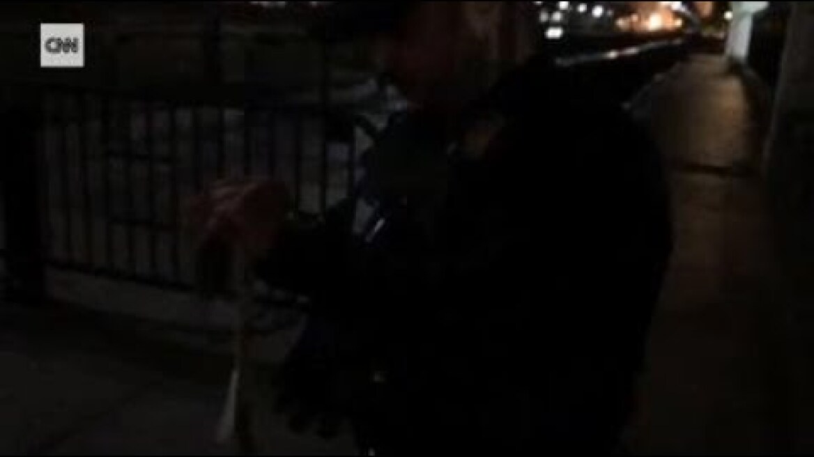 U.S. Secret Service agent takes away CNN correspondent's White House pass