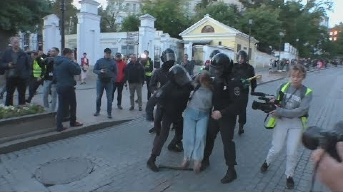 Clip of Russian policeman punching female protester stirs anger