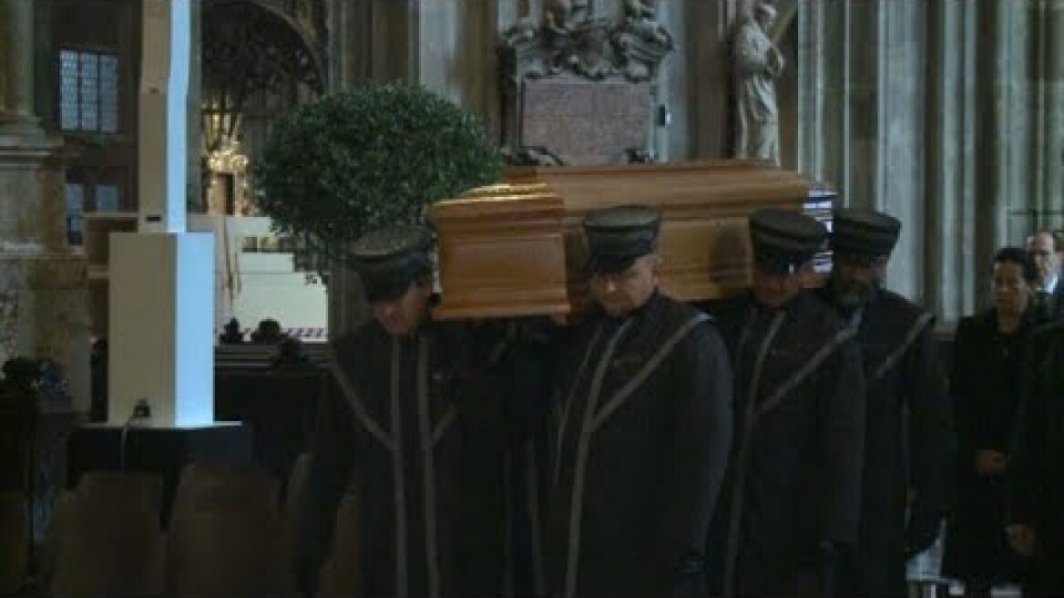 F1 legend Niki Lauda's coffin carried inside Vienna cathedral