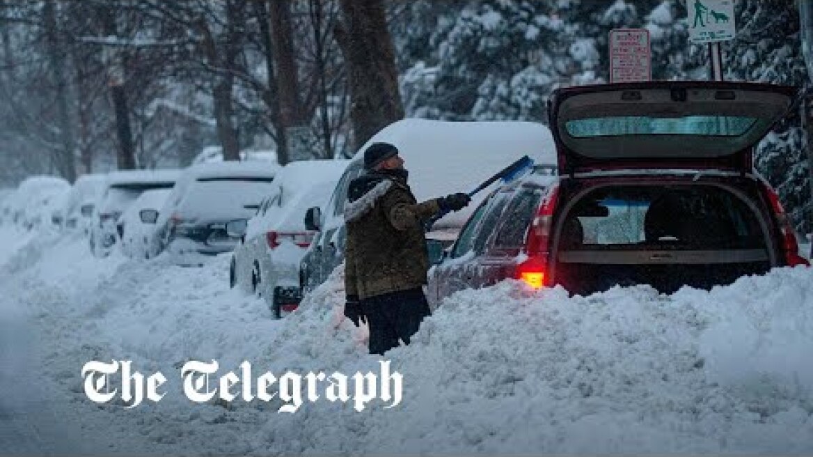 Bombogenesis snow storm batters US East Coast