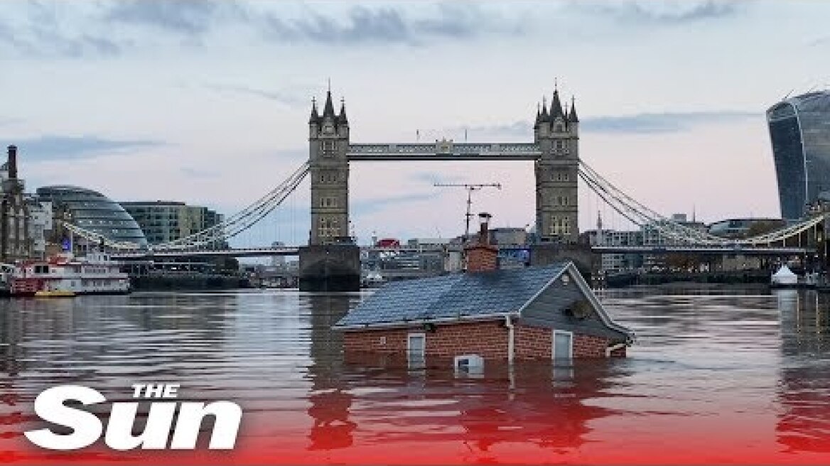 Extinction Rebellion protesters float ‘sinking house’ down the river Thames