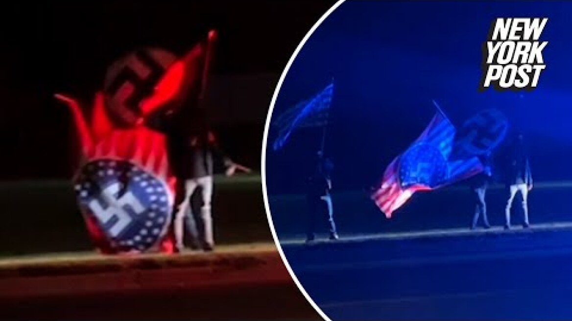 White supremacists caught on camera waving Nazi flags outside Anne Frank play in Michigan
