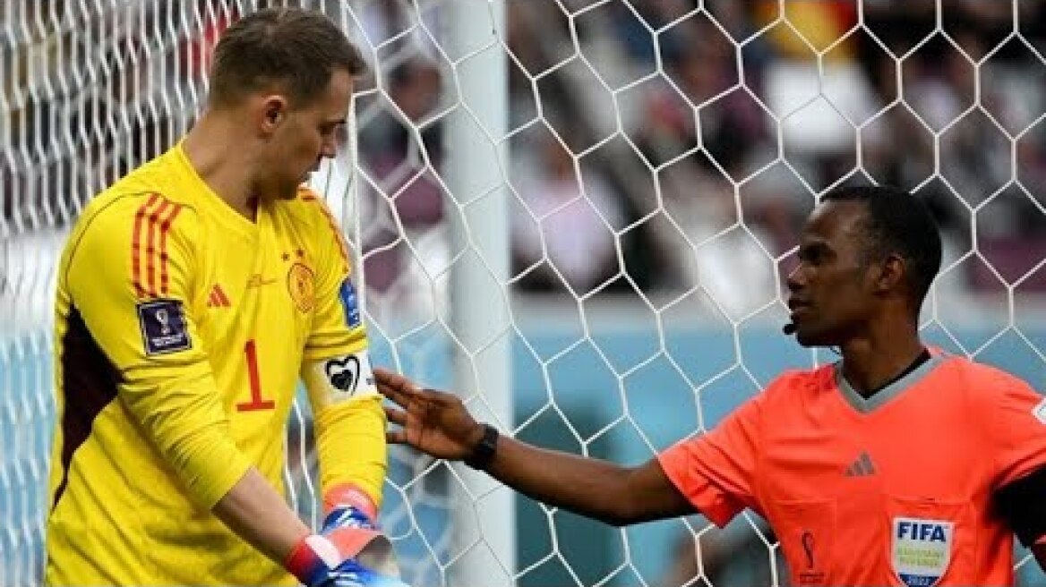 Referee checks Germany goalkeeper Manuel Neuer is not wearing One Love armband at World Cup in Qatar