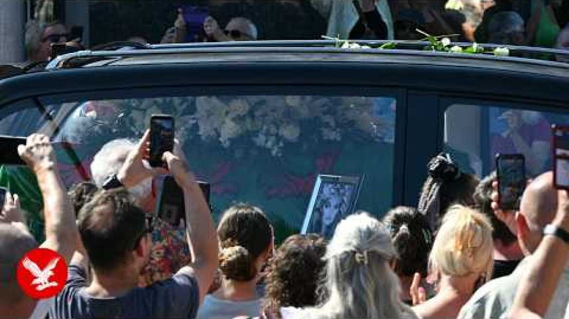 Bonnie Tyler fans line the streets of a Welsh village as her coffin is brought home